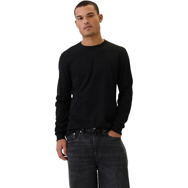 a man wearing a long sleeve casual everyday shirt over pants