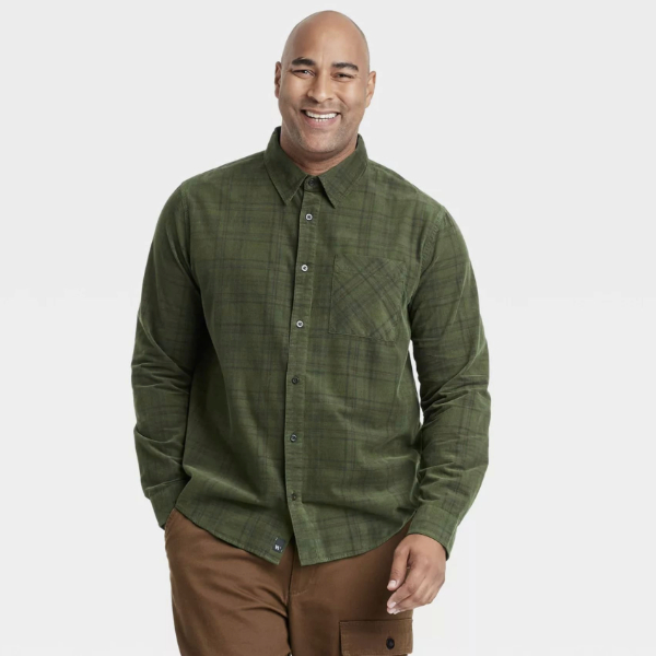 a man wearing a long sleeve plaid button down shirt