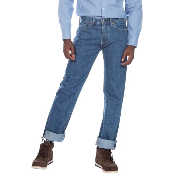 man wearing regular fit denim jeans with a long sleeve shirt and boots