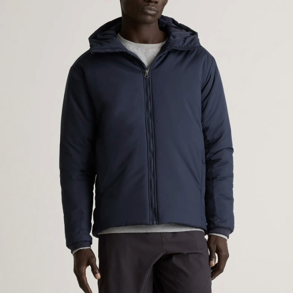 a heavyweight hooded jacket over a shirt and pants