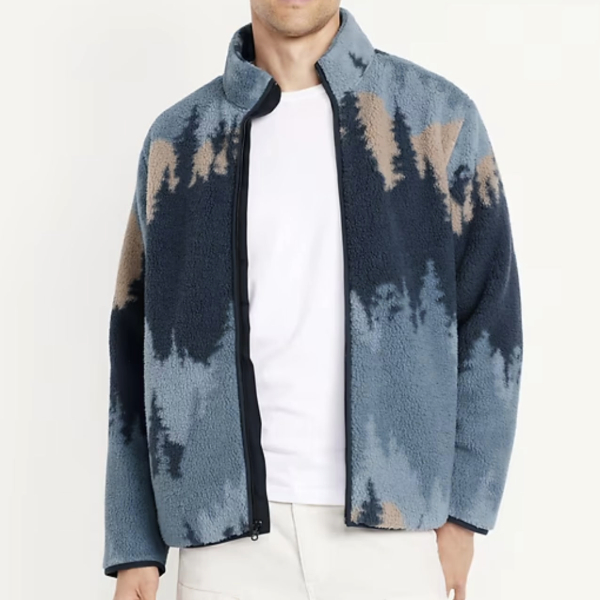 a man wearing a sherpa zip front jacket over a casual shirt