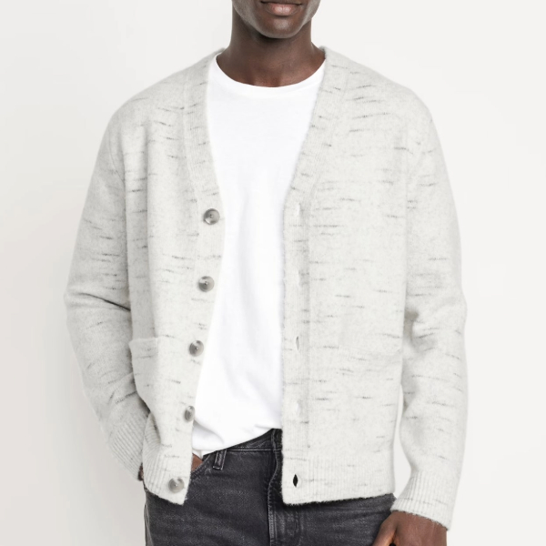 a man wearing a cardigan over a casual shirt