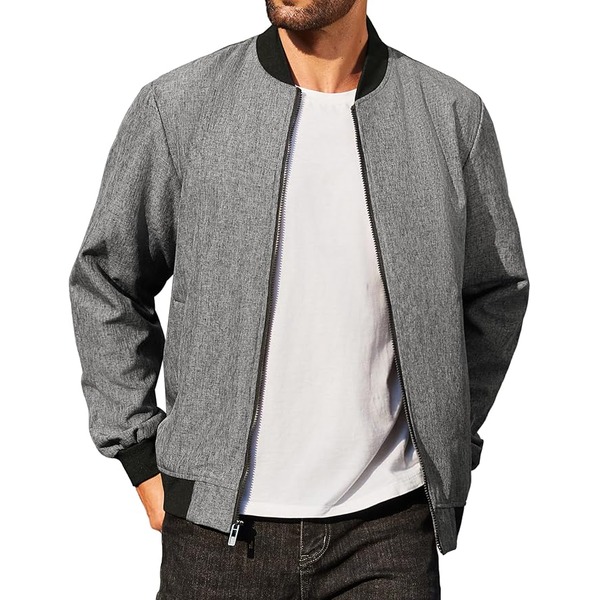 a man wearing a varsit style jacket over a crew neck shirt