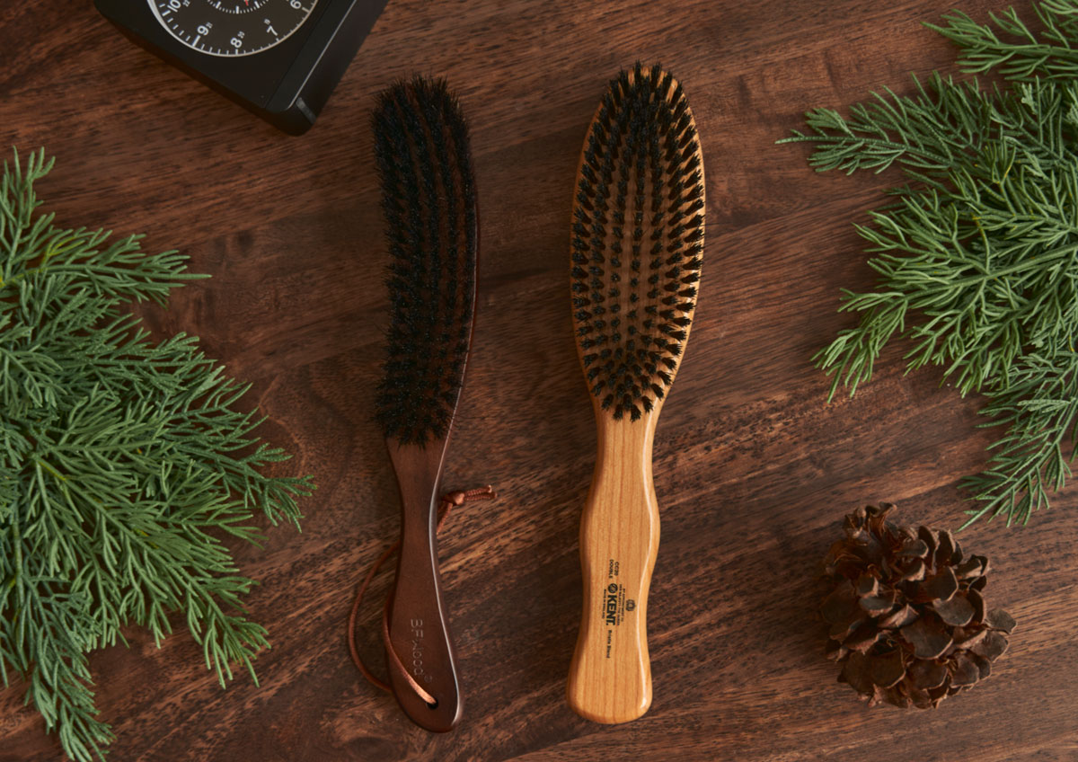 two men's clothing brushes