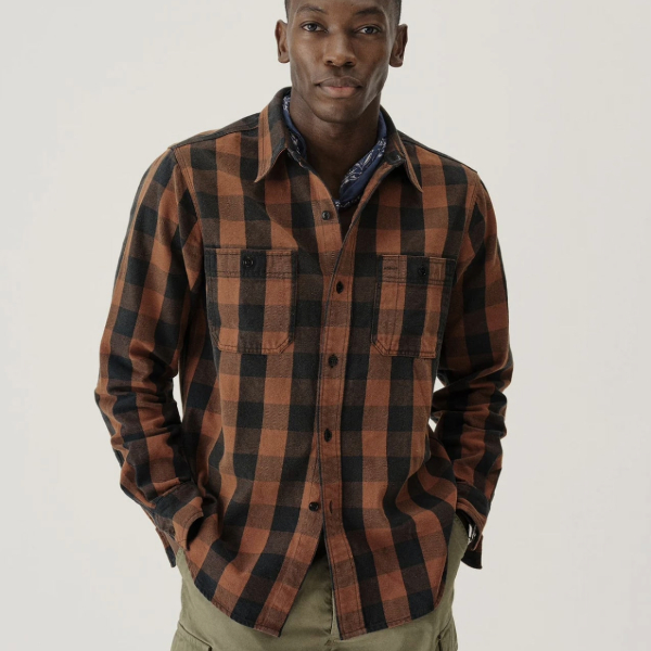 a man wearing a flannel workshirt