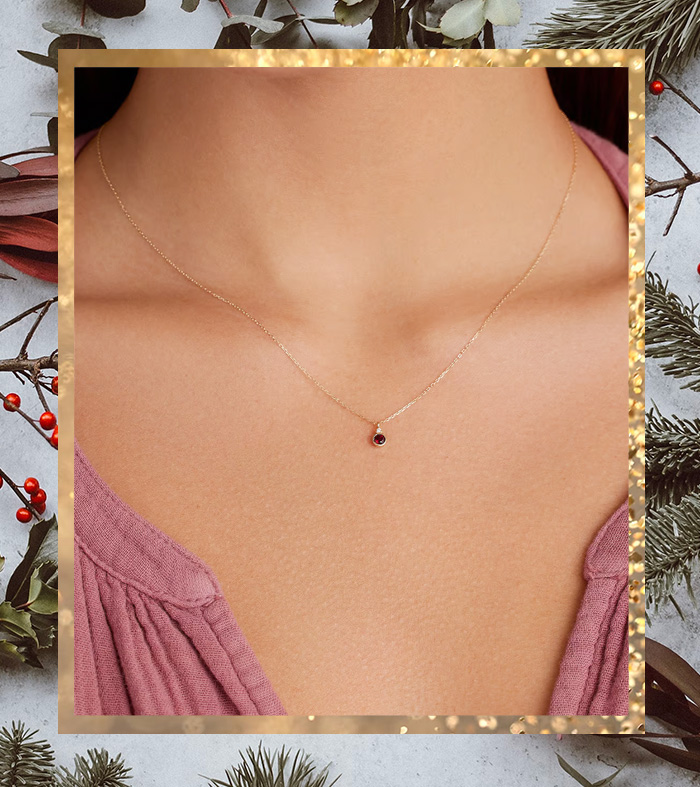 birthstone necklace on a gold chain