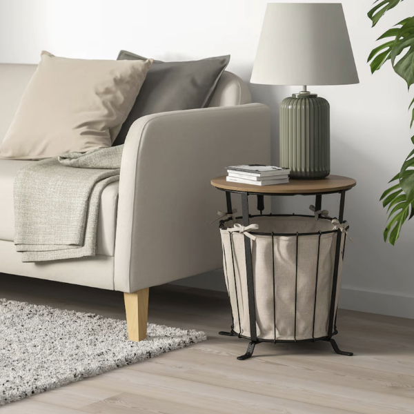 a side table with storage bin below the table top space