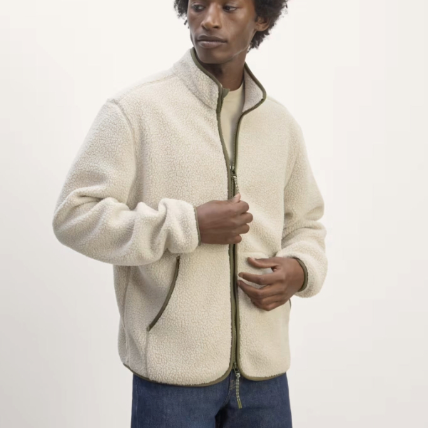 a man wearing a zip front long sleeve fleeze over shirt