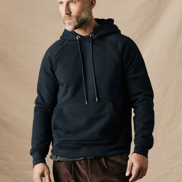 a man wearing a pullover hoodie