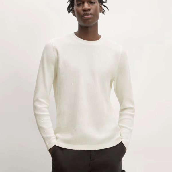 a man wearing a waffle knit long sleeve crew neck shirt