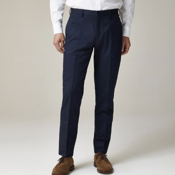 a man wearing slim fit suit pants with dress shoes