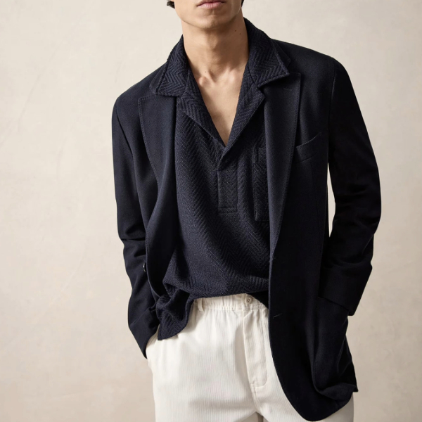 man wearing an Italian knit navy sport coat over a polo shirt and pants