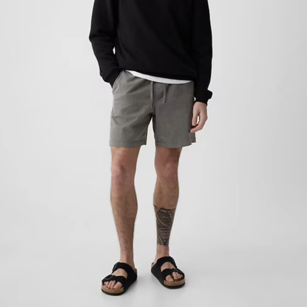 a man wearing shorts with 7 inch inseam and sandals