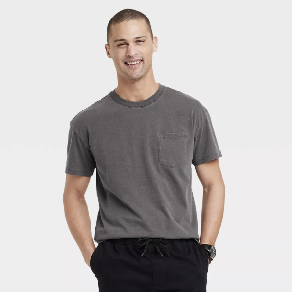 man wearing a short sleeve shirt tucked in to casual pants