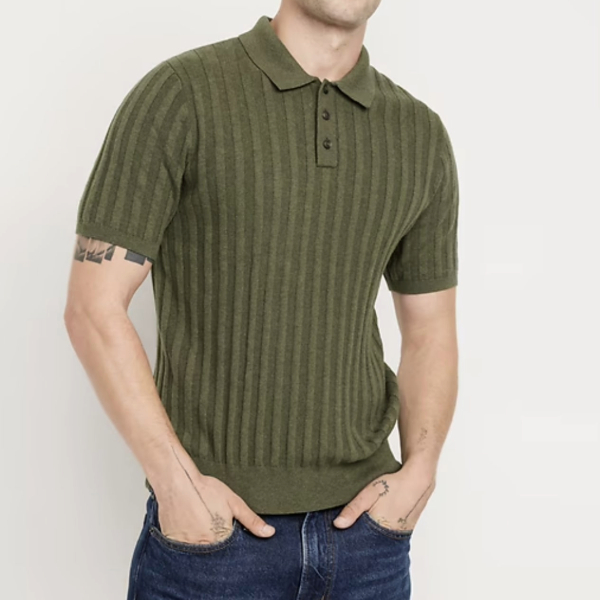 a man wearing short sleeved ribbed sweater polo shirt and denim jeans