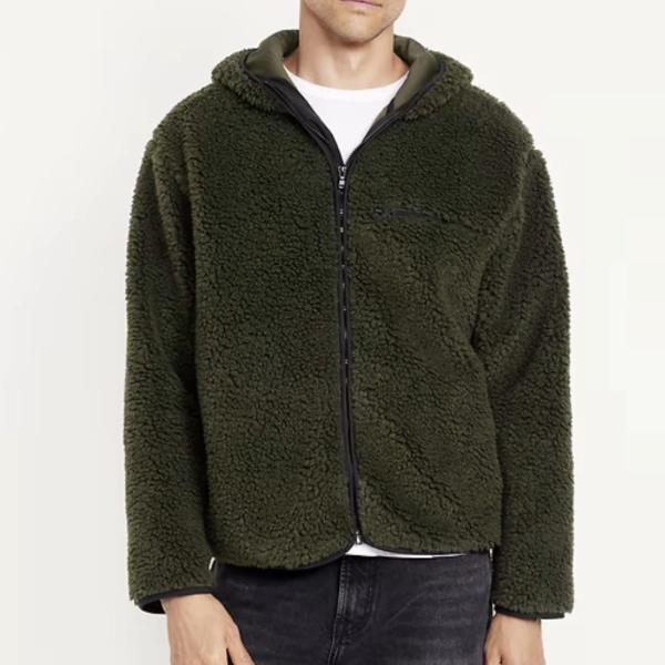 a man wearing a hooded sherpa jacket