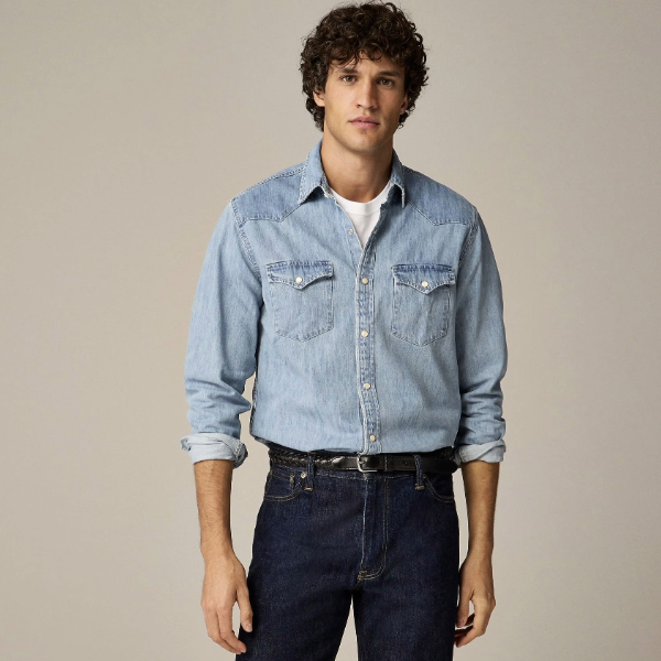 a man wearing a western style denim shirt with denim jeans