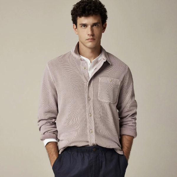 a man wearing a cotton waffle knit long sleeve shirt over chino pants