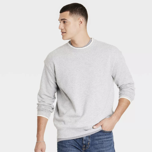 man wearing a pullover sweater and denim jeans