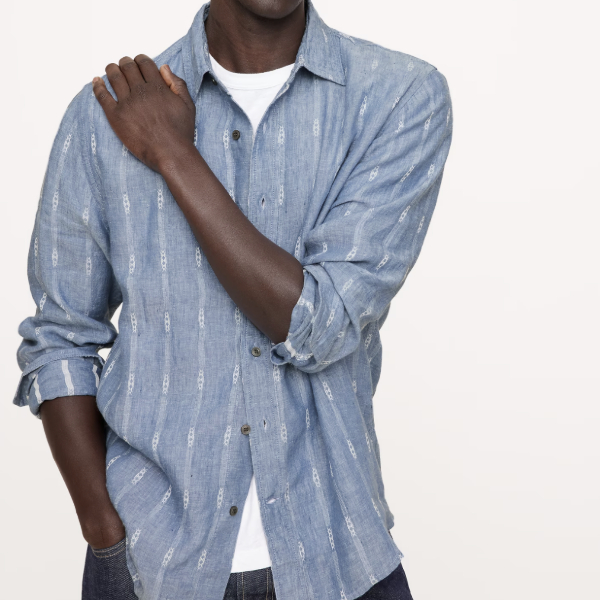 man wearing a standard fit button front linen printed shirt