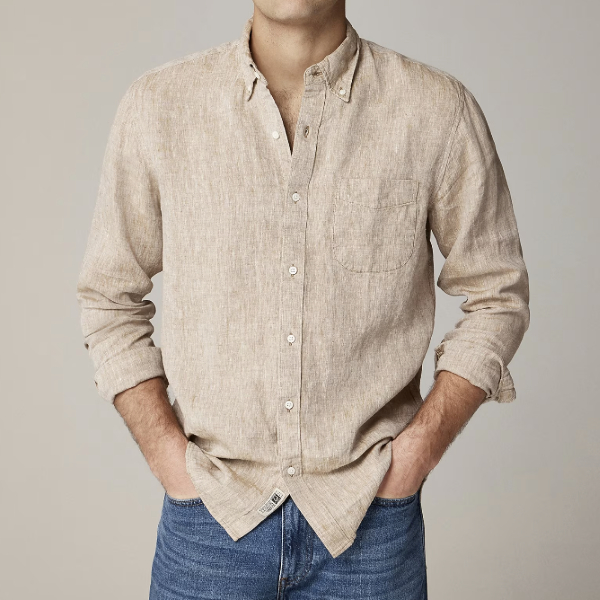 man wearing an Irish linen long sleeve button front shirt with denim pants