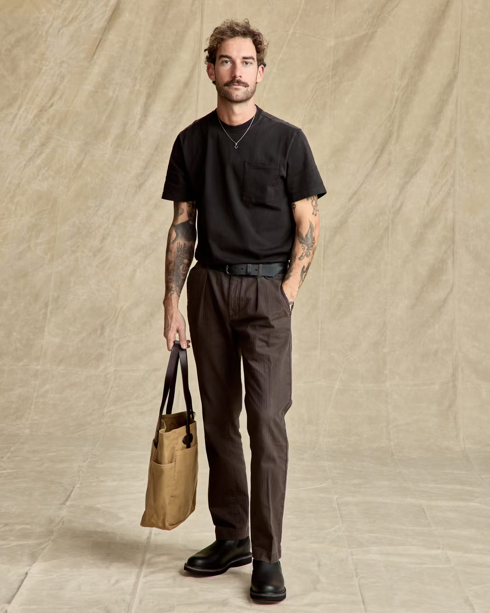 man wearing black pocket t-shirt