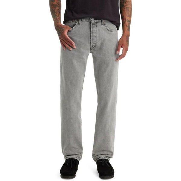 a man wearing original fit levis 501 jeans with casual shoes