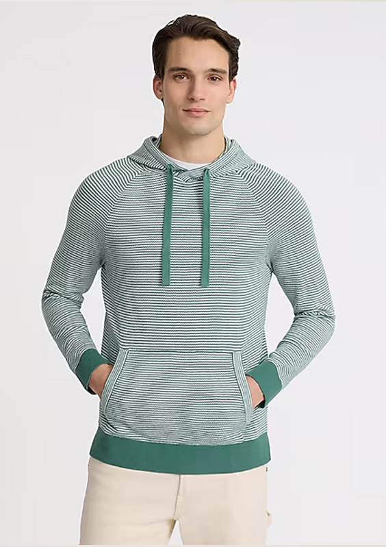 a man wearing a striped hoodie sweater