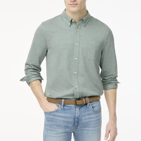 man wearing a long sleeve button front oxford shirt