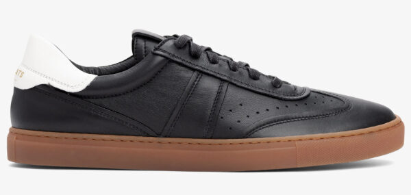 a low top lace up gum sole leather upper sneaker