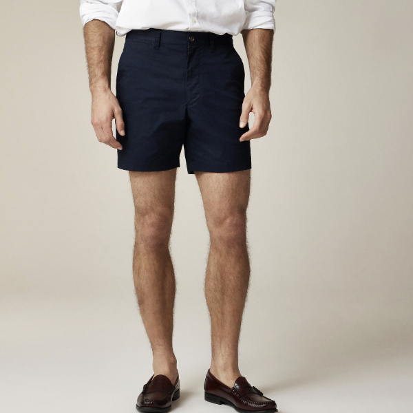 man wearing stretch chino shorts with a button front shirt and loafer shoes