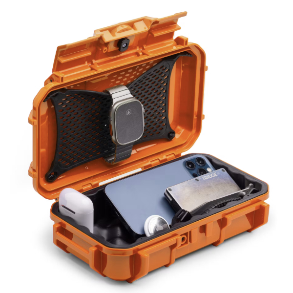 a dry box with rubber insert for extra insulation and filled with assorted gear items