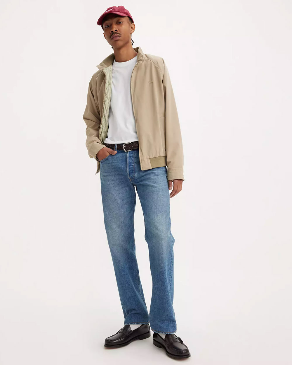 man wearing medium wash levis 501 straight fit jeans