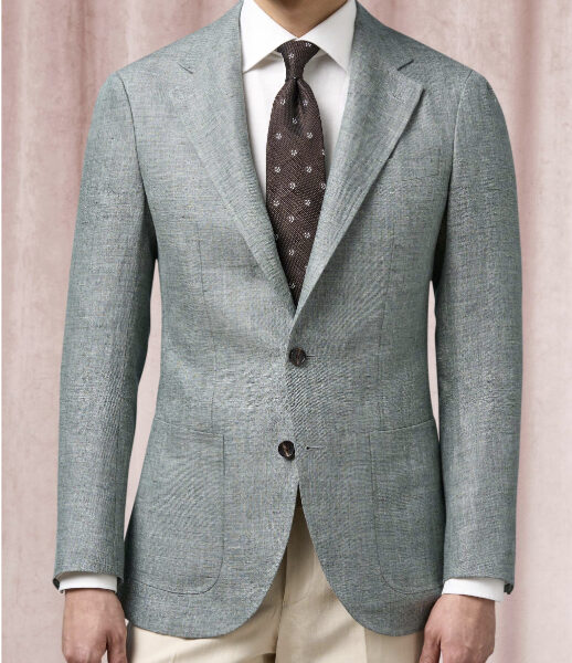 a man wearing a linen sport coat with a dress shirt and tie