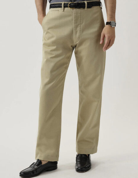 a person wearing twill chino pants with slip on dress shoes