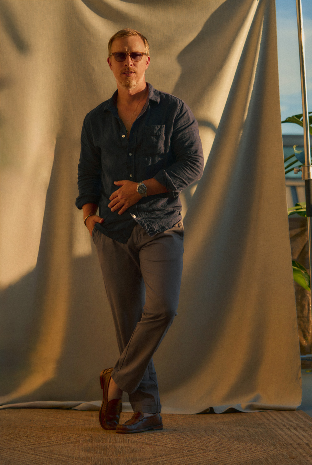 man wearing a linen long sleeve button down shirt