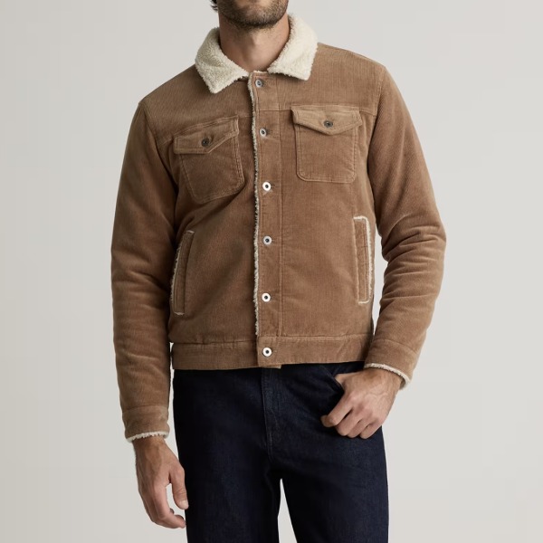 man wearing a courduroy trucker style jacket with sherpa lining and collar