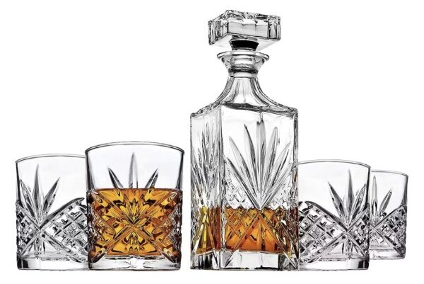 a 5 piece whiskey set with four drinking glasses and decanter