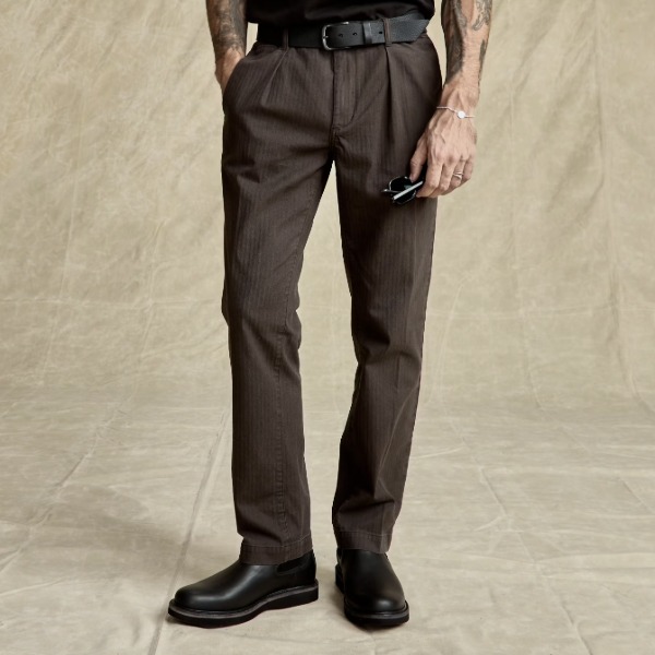 man wearing a pleated herrinbone pattern chino pant