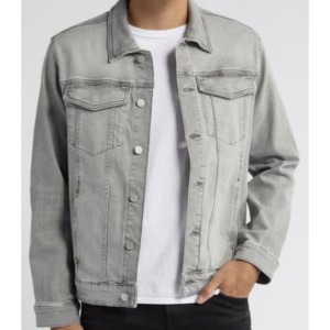 man wearing a grey denim trucker style jacket over a crew neck shirt