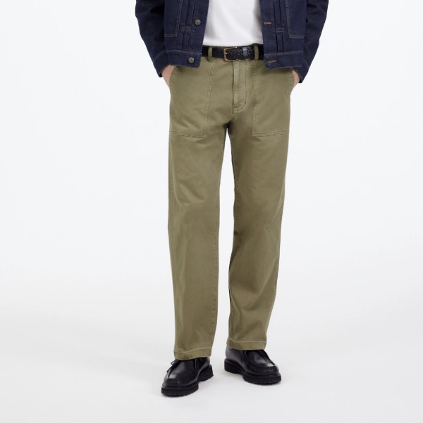 man wearing fatigue style pants and closed toe shoes