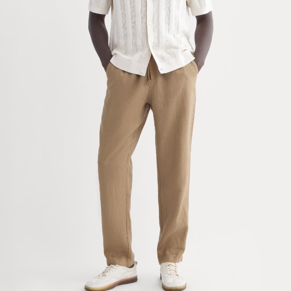man wearing linen pant with short sleeve shirt and casual shoes