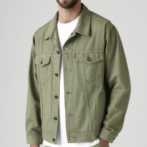 man wearing a green trucker style jacket