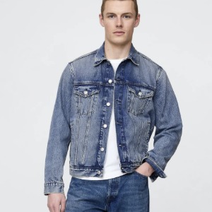 man wearing a denim trucker jacket