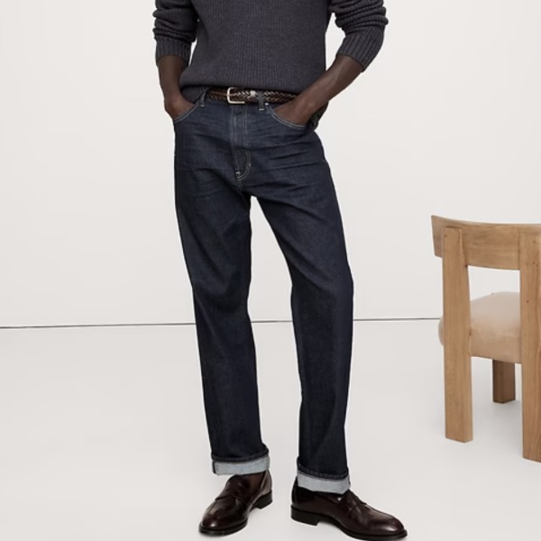 man wearing straight fit denim jeans with boots