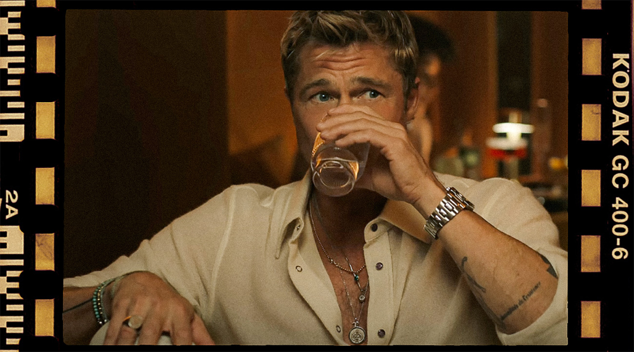 Brad Pitt wearing lots of jewelry for his character Sonny Hayes in F1 brad pitt wearing jewelry in F1 movie, multiple necklaces, rings, bracelets and watch