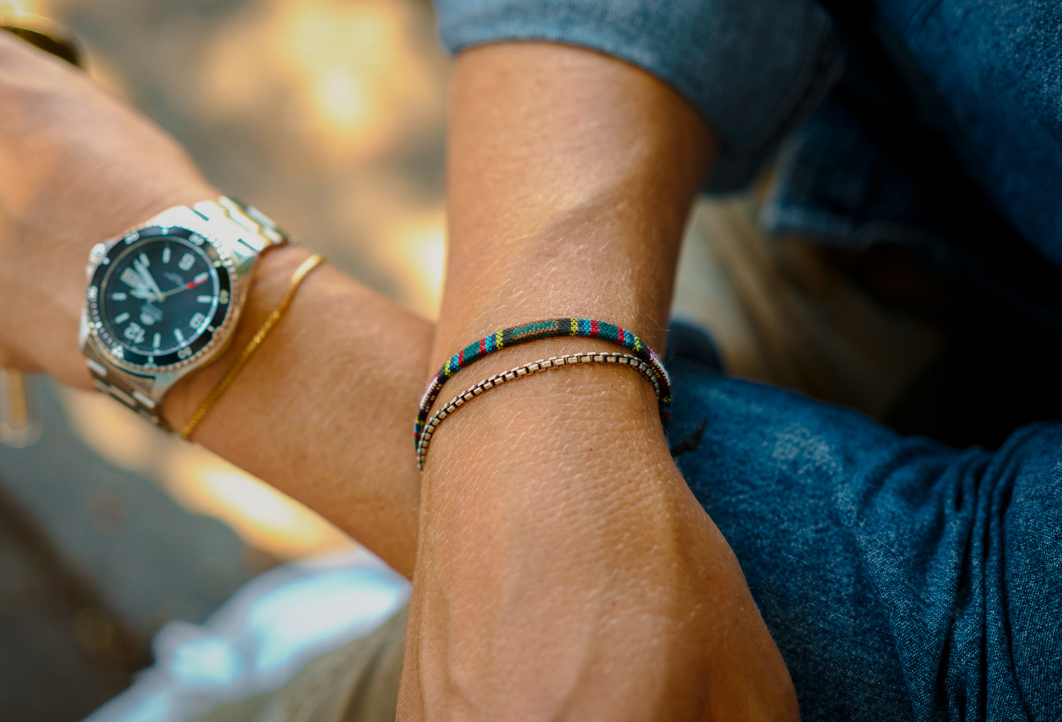men-box-chain-bracelet men silver box chain layered with other bracelets and watch
