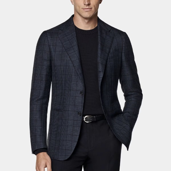 man wearing a navy blazer with a crew neck shirt and dress pants