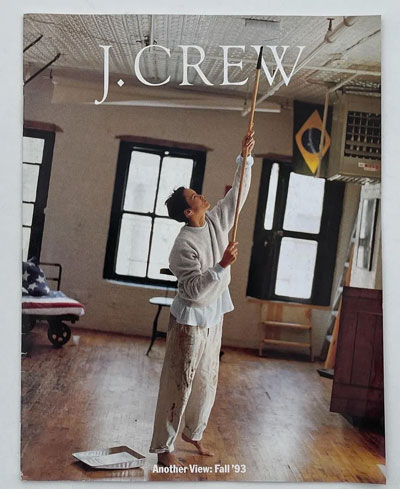 a jcrew cover showing a person painting a ceiling in khakis