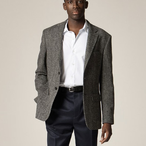 man wearing an English wool sportcoat with a button front collared shirt and dress pants